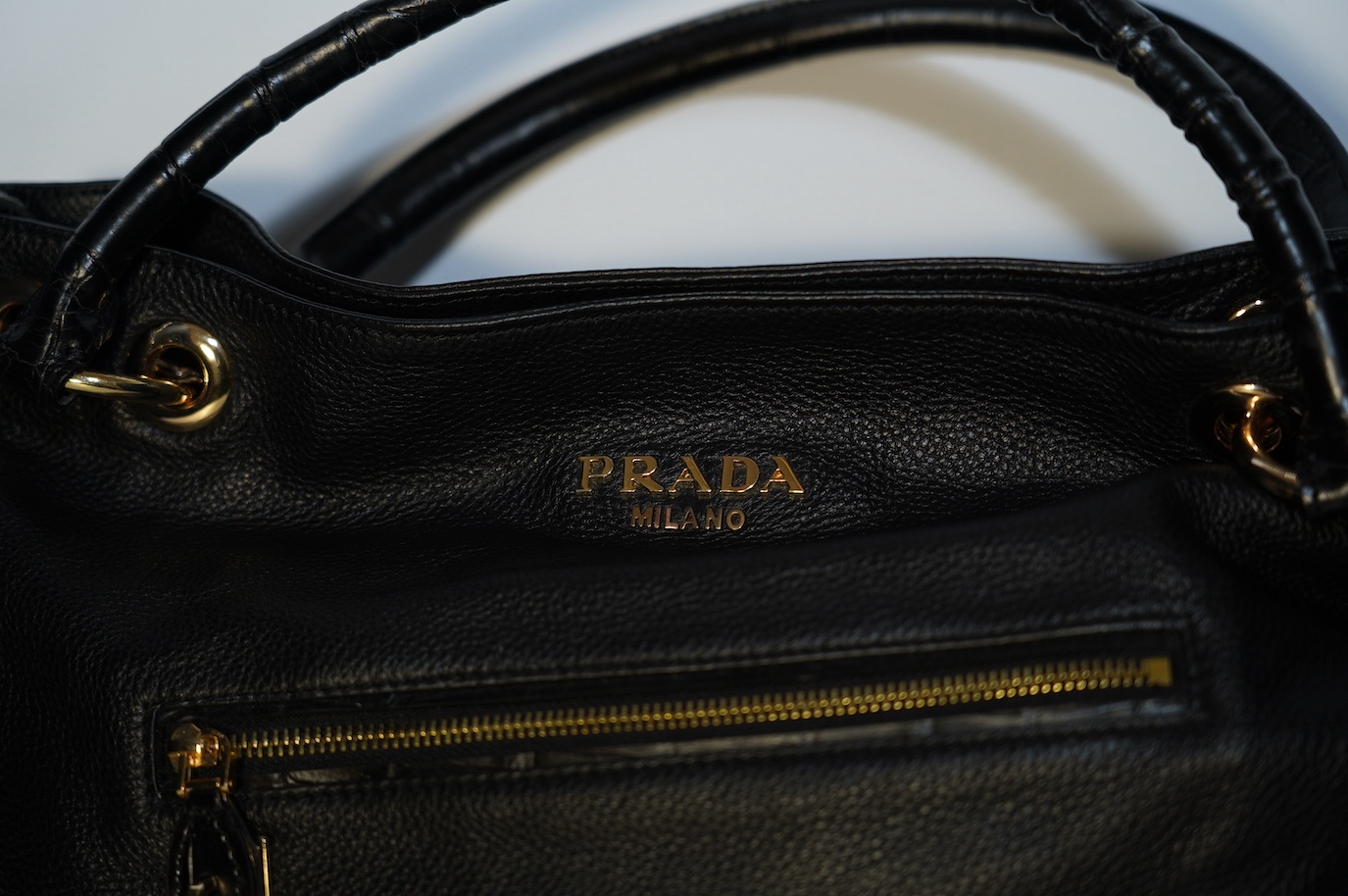 A black leather Prada handbag